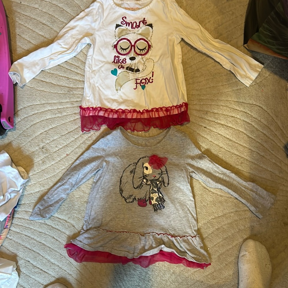 Two kids long sleeve shirts with rufffle bottoms.